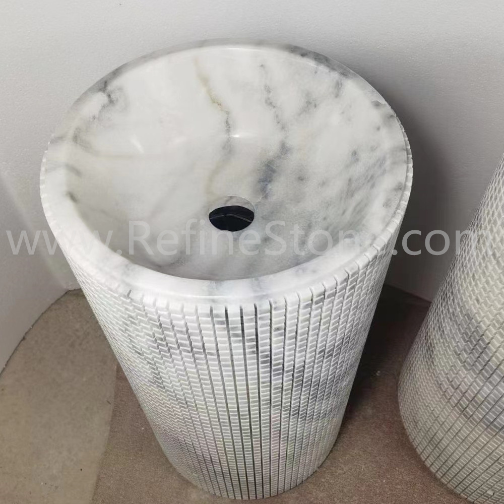 White marble pedestal sink